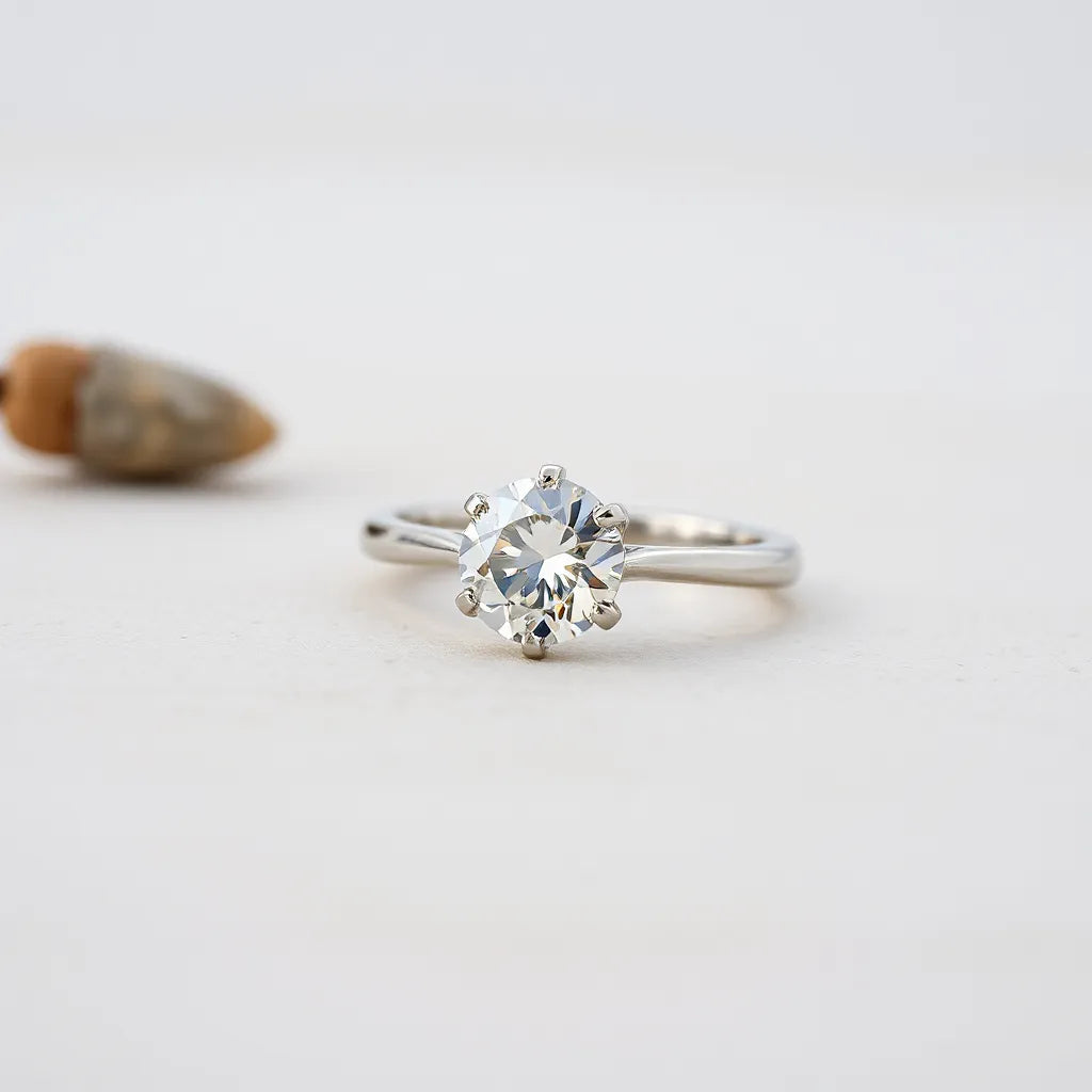 Sparkling moissanite engagement ring with a round center stone in a minimalist setting
